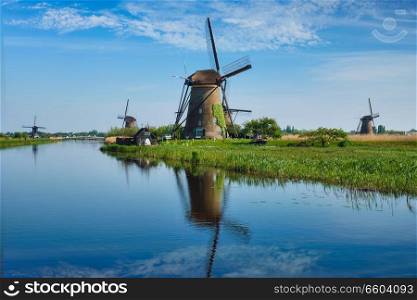 Netherlands rural lanscape with windmills at famous tourist site Kinderdijk in Holland. Windmills at Kinderdijk in Holland. Netherlands