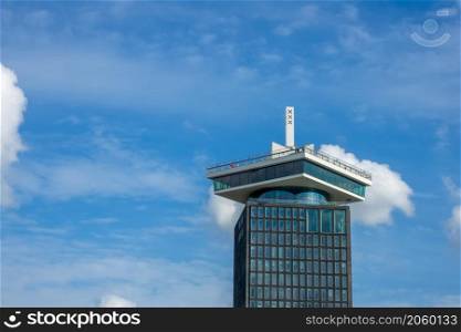 Netherlands. Sunny day in Amsterdam. The top of the ADAM tower against a blue sky with light clouds. Top of the ADAM Tower in Amsterdam Against the Blue Sky