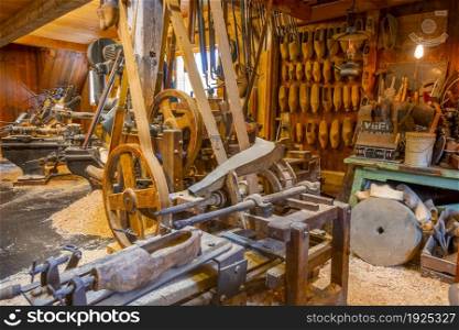 Netherlands. The interior of a workshop with old woodworking machines for the manufacture of the Dutch national footwear Klomps. Old Dutch Klomp Workshop