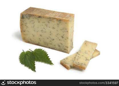 Nettle cheese and leaves on white background