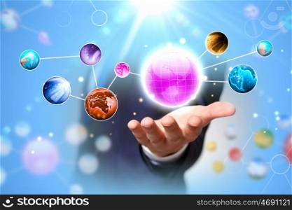 Network concept. Close up of human hand holding globe image