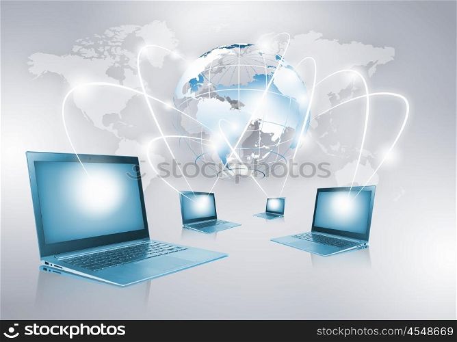 Network concept. Image of laptop with globe illustration at background