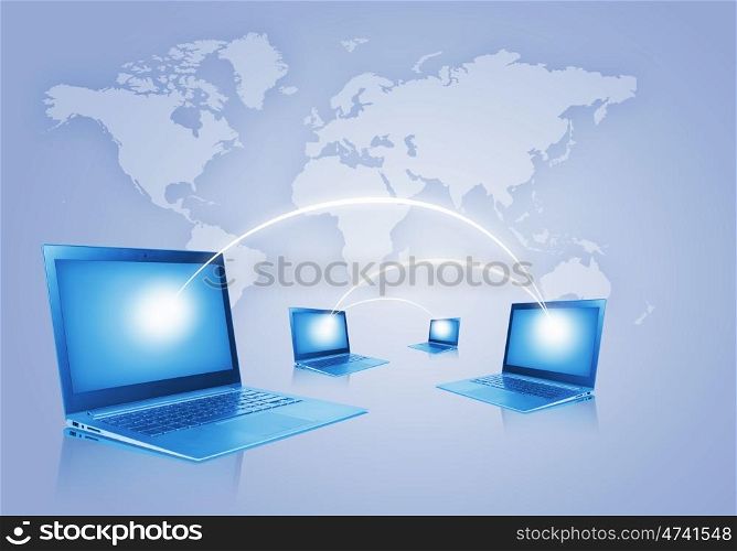 Network concept. Laptops against world map background. Connection and cooperation