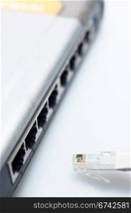 network hub switch with lan cable disconnected over white