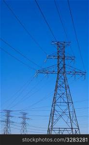 Network of transmission towers and wires.