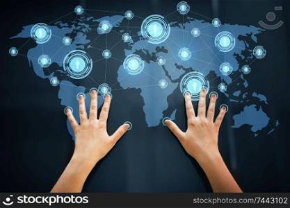 network, technology and communication concept - hands using interactive panel with virtual contacts icons and world map. hands using interactive panel with network icons