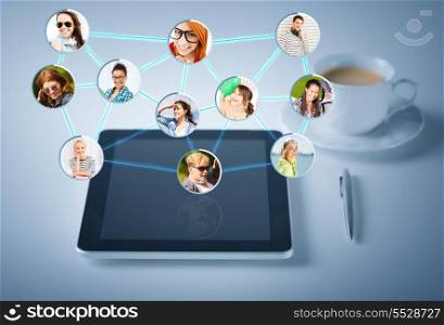 networking, communication and technology concept - cup of coffee and tablet pc with social network
