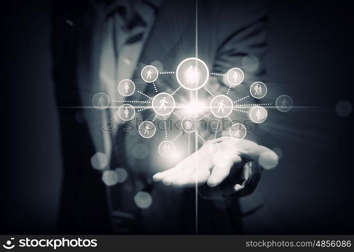 Networking concept. Close up of businessperson holding media icons in palm