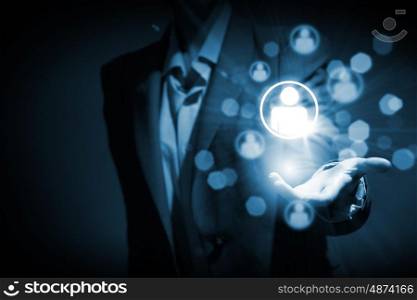 Networking concept. Close up of businessperson holding media icons in palm