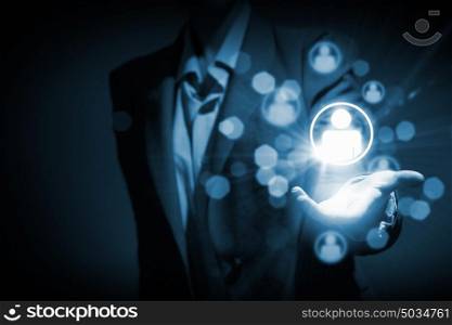 Networking concept. Close up of businessperson touching icon of media screen