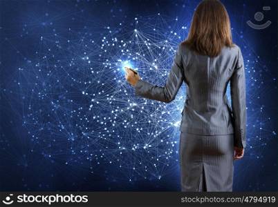 Networking concept. Rear view of businesswoman drawing on media screen