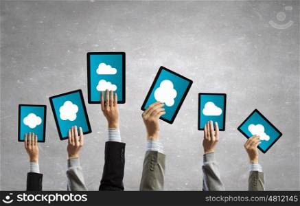 Networking concept. Team of business people holding tablets in hands