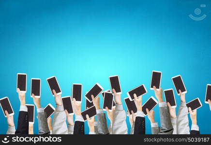 Networking concept. Team of business people holding tablets in hands