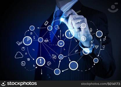 Networking connection. Close up of businessman drawing connection lines on screen