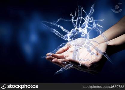 Neurology study. Close up of man hand holding nerve symbol