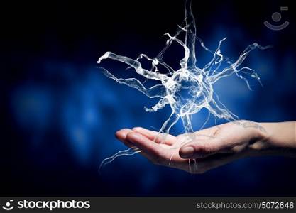 Neurology study. Close up of man hand holding nerve symbol