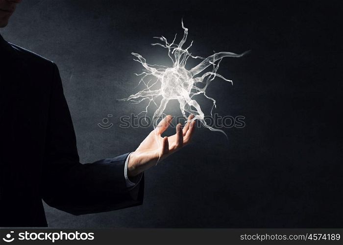 Neurology study concept. Close up of man hand holding nerve symbol in palms
