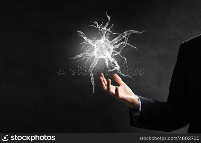 Neurology study concept. Close up of man hand holding nerve symbol in palms