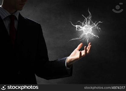 Neurology study concept. Close up of man hand holding nerve symbol in palms