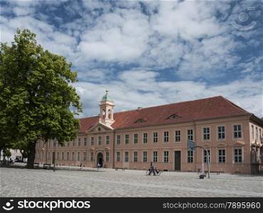 Neuruppin, Ostprignitz-Ruppin, state Brandenburg, Germany - school place with the old school. The building was built in 1790 in the style of a Baroque palace. Today it is the central building of the historic old town. Famous students were Theodor Fontane, Karl Friedrich Schinkel and Wilhelm Gentz
