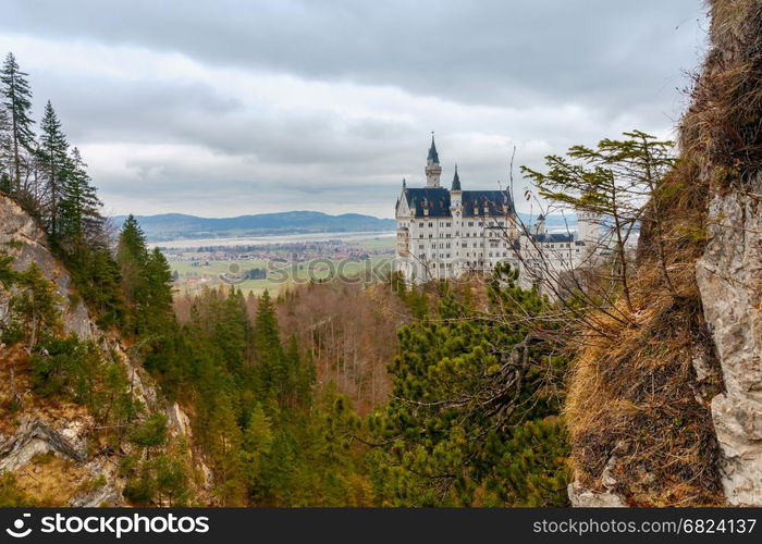 Neuschwanstein Castle fortress In the Bavarian Alps.. The famous German castle Neuschwanstein under dramatic sky. Germany. Bavaria.