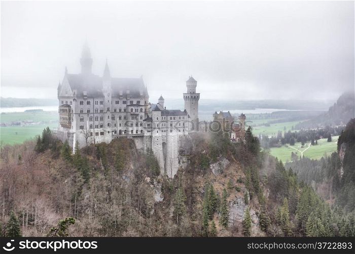 Neuschwanstein castle in fog, Germany