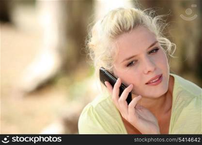 Neutral woman talking on her mobile phone