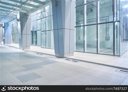 New and empty modern glass facade business office building exterior with floor ,night scene .