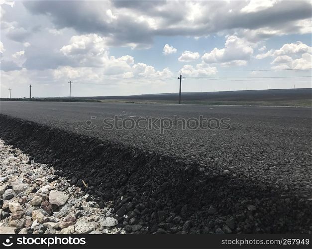 New asfalt on a highway. Side view. Russia