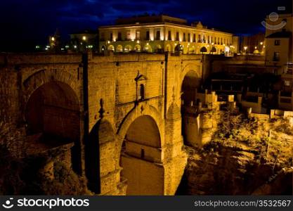 New Bridge (Spanish: Puente Nuevo) from 18th century illuminated at night, famous historic landmark in the town of Ronda, southern Andalusia, Spain.