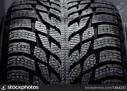 new car tire background. close up of texture. Stack of brand new high performance car tires on clean high-key white studio background. Stack of brand new high performance car tires on clean high-key white studio background. new car tire background. close up of texture