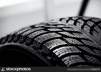 new car tire background. close up of texture. Stack of brand new high performance car tires on clean high-key white studio background. Stack of brand new high performance car tires on clean high-key white studio background. new car tire background. close up of texture