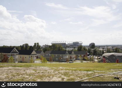 new charleston styled row houses with stadium in background