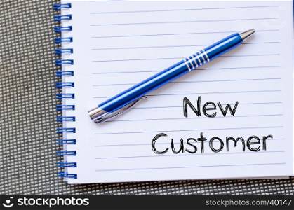 New customer text concept write on notebook