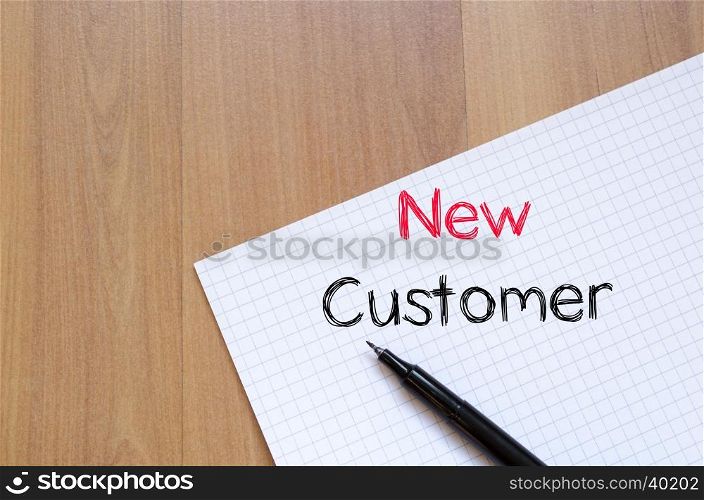 New customer text concept write on notebook