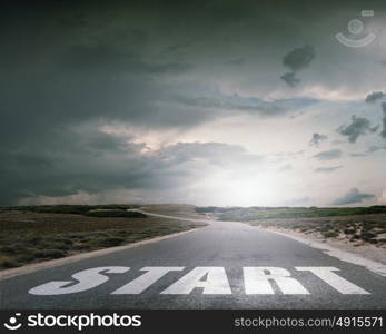 New day new life. Start word as motivation writen on asphalt road