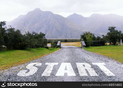 New day new life. Start word as motivation writen on asphalt road