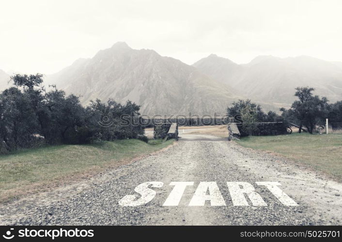 New day new life. Start word as motivation writen on asphalt road