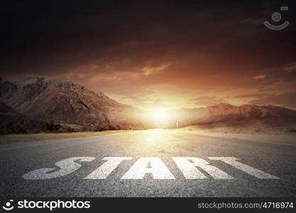 New day new life. Start word on asphalt road and sunrise at horison line