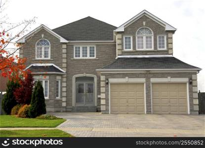 New detached single family luxury home with stone facade