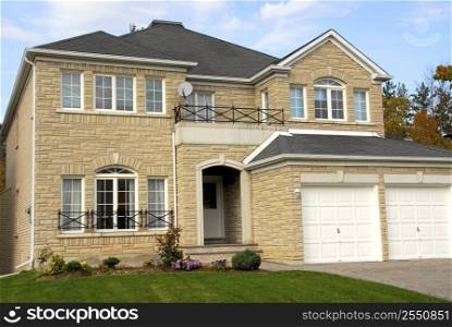 New detached single family luxury home with stone facade and double garage
