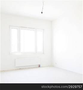 new empty apartment with window and white walls