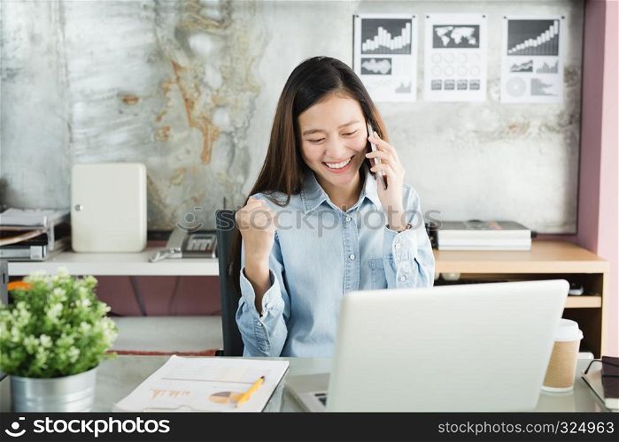 New generation business woman using smartphone,Asian woman are happily working in the office, Working Successful Concept