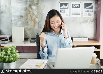 New generation business woman using smartphone,Asian woman are happily working in the office, Working Successful Concept