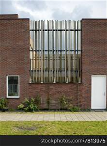 New housing development near Amsterdam, using a variety of natural construction materials, such as brick, wood, steel and concrete, build up of prefab parts in geometrical shapes and straight angles