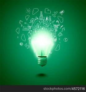 New idea. Conceptual image of electric bulb against green background