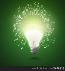 New idea. Conceptual image of electric bulb against green background