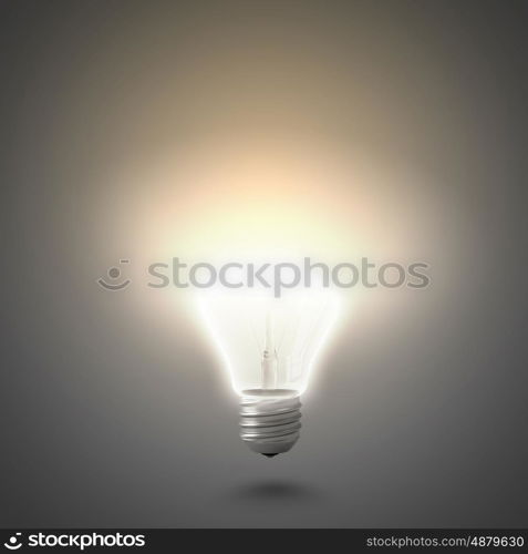 New idea. Conceptual image of electric bulb against grey background