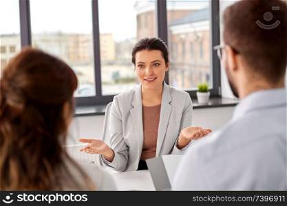 new job, hiring and employment concept - team of recruiters having interview with female employee at office. recruiters having job interview with employee