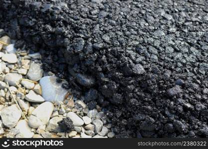 New layer of asphalt road under construction